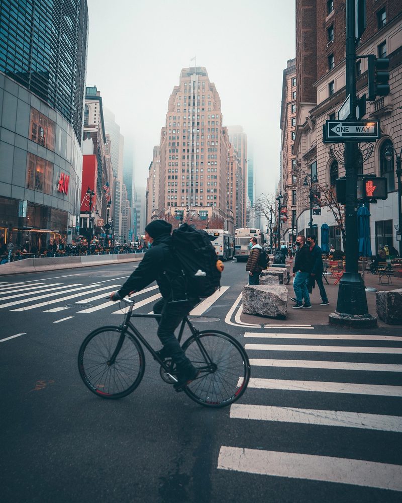 Cyclist riding through a city street